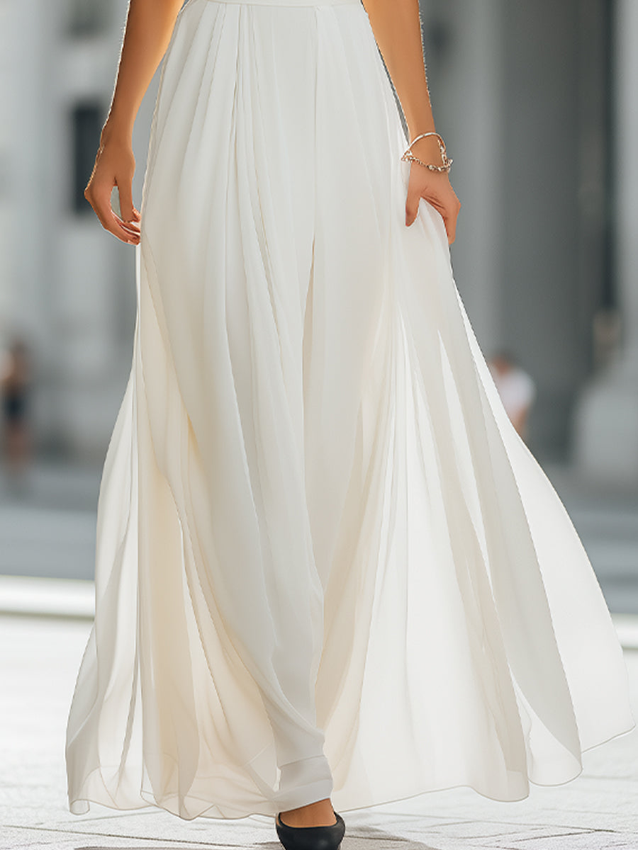 Léon Varel Pleated Halter Neck Maxi Dress with Flowing Skirt