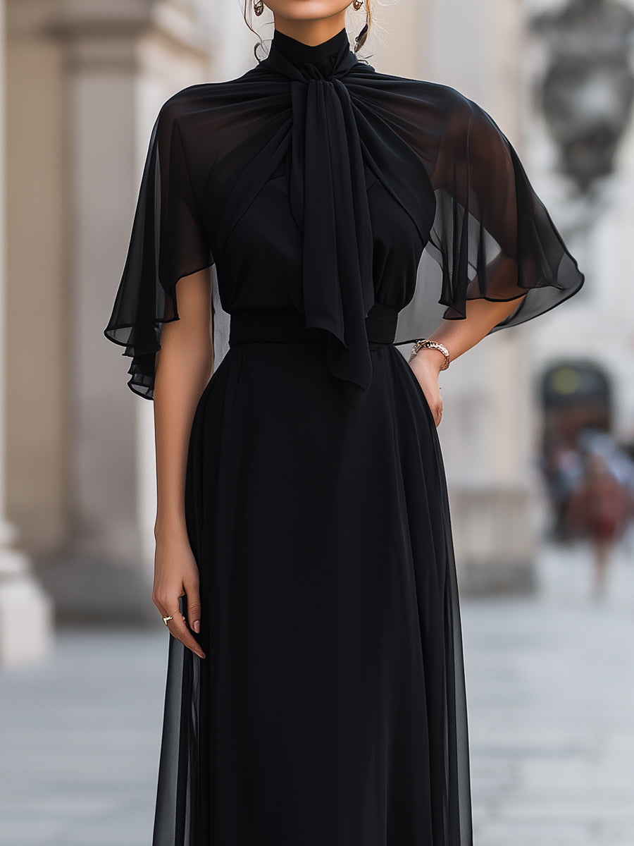 Léon Varel Sheer Tie-Neck Maxi Dress With Flutter Sleeves And Layered Skirt