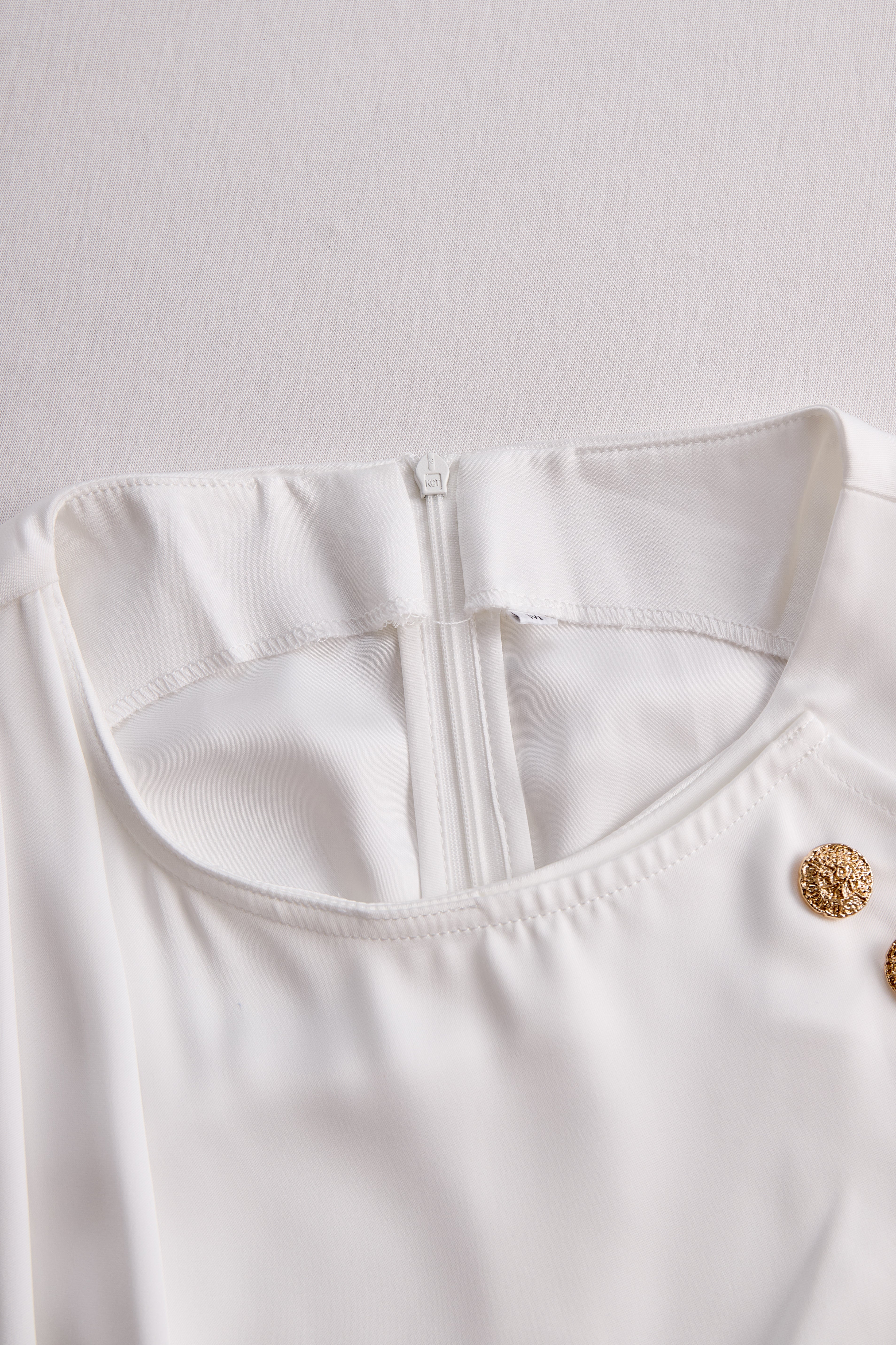 Léon Varel Elegant White Draped Top with Button Detail